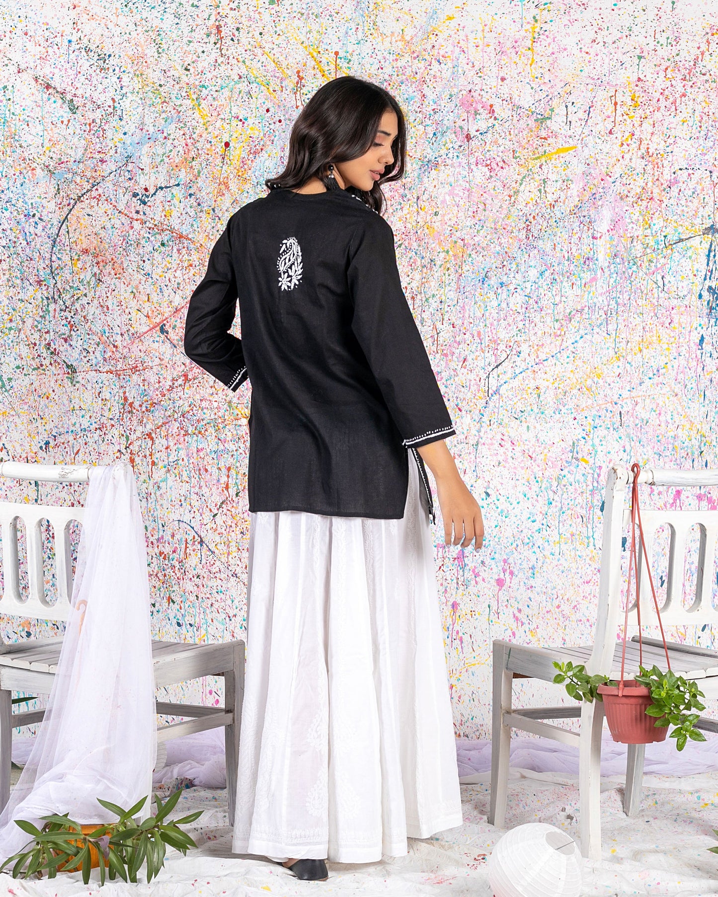 Aafrinish Rimen Hassan Black and white short kurti white sharrara splatter painting back
