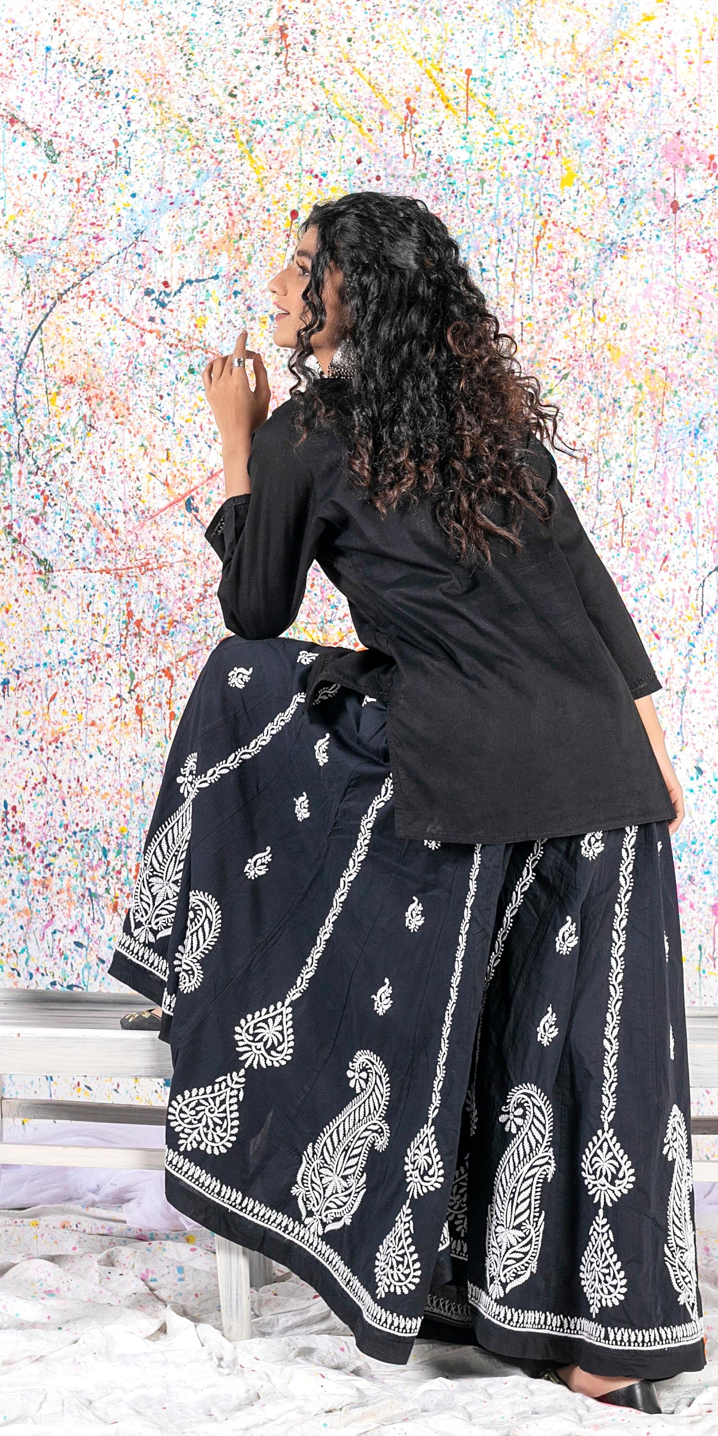 Aafrinish Rehma zaman black kurti black embroidery Chikan Kari Kurta Black on Black Splatter painting curly hair back