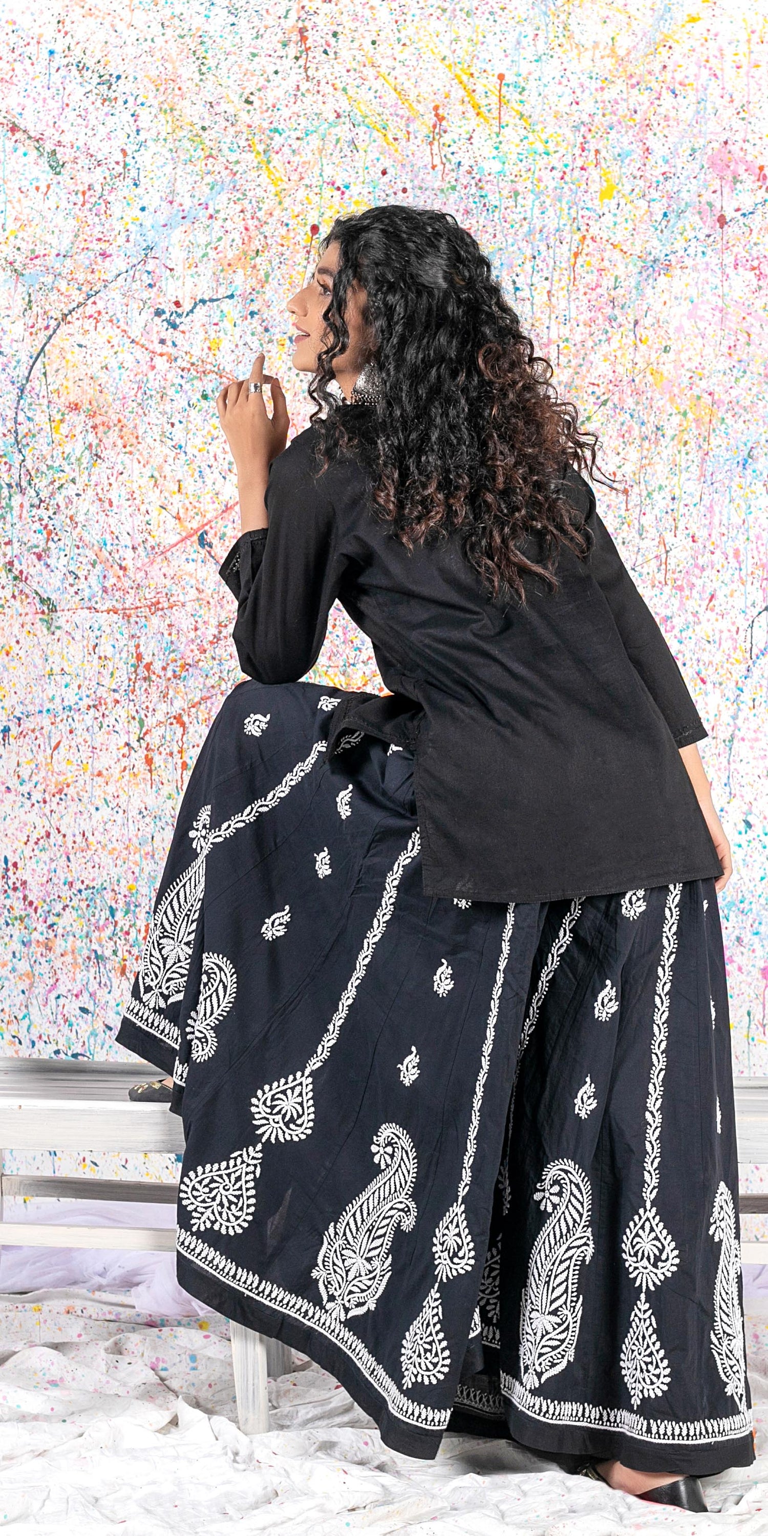 Aafrinish Rehma zaman black kurti black embroidery Chikan Kari Kurta Black on Black Splatter painting curly hair back